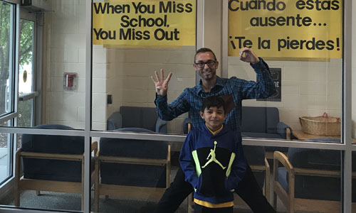 principal posing with student 